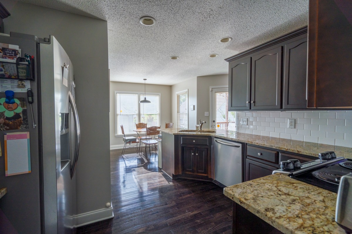 883 South Ridge Trail Clarksville, TN 37043 - Photo 8 of 42 Convenient kitchen with granite countertops, stainless steel appliances (refrigerator stays) and a cosy kitchen eating nook
