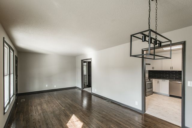 a view of a livingroom with wooden floor