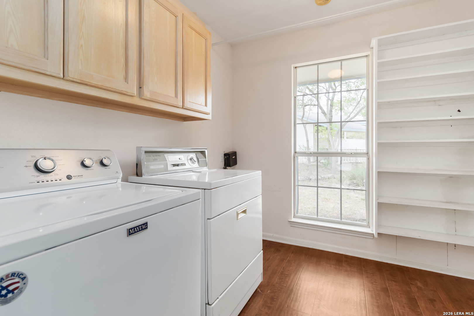 31949 Oak Ridge Parkway Bulverde, TX 78163 - Photo 19 of 50 a utility room with cabinets washer and dryer