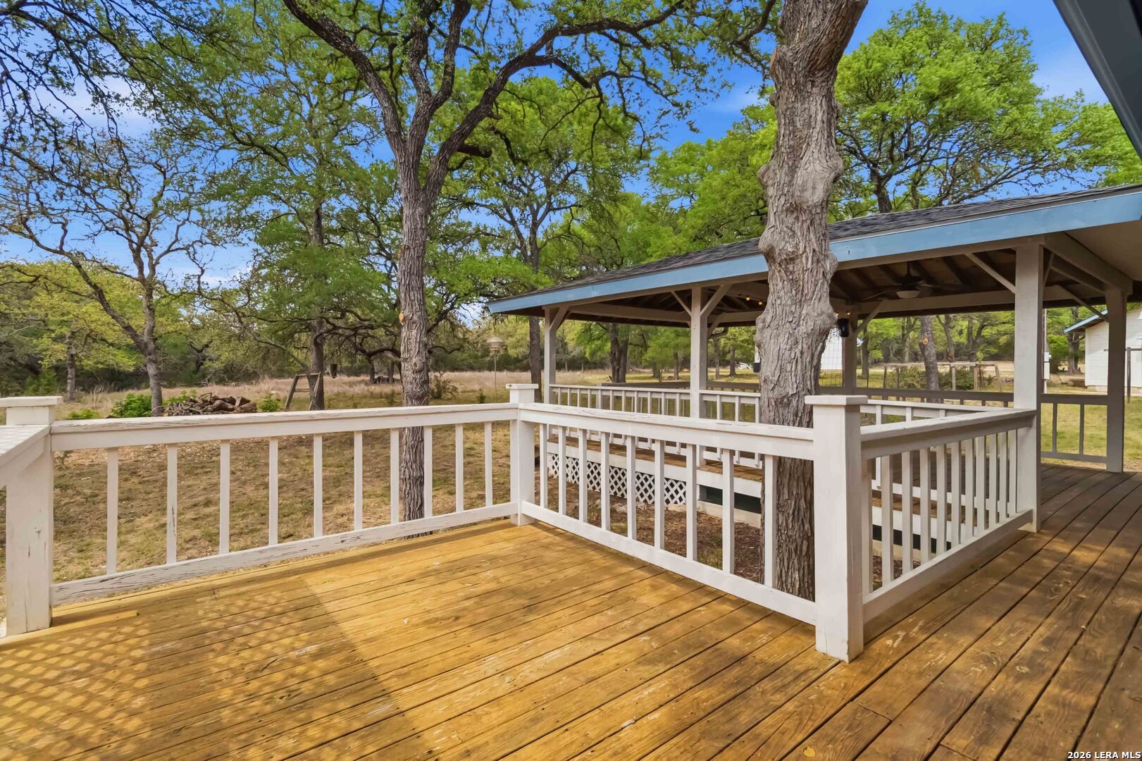 31949 Oak Ridge Parkway Bulverde, TX 78163 - Photo 20 of 50 a view of a wooden deck and a yard