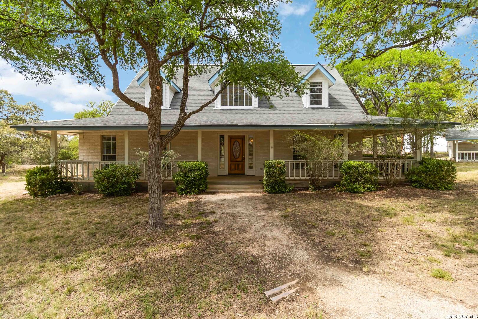 31949 Oak Ridge Parkway Bulverde, TX 78163 - Photo 2 of 50 a front view of a house with garden