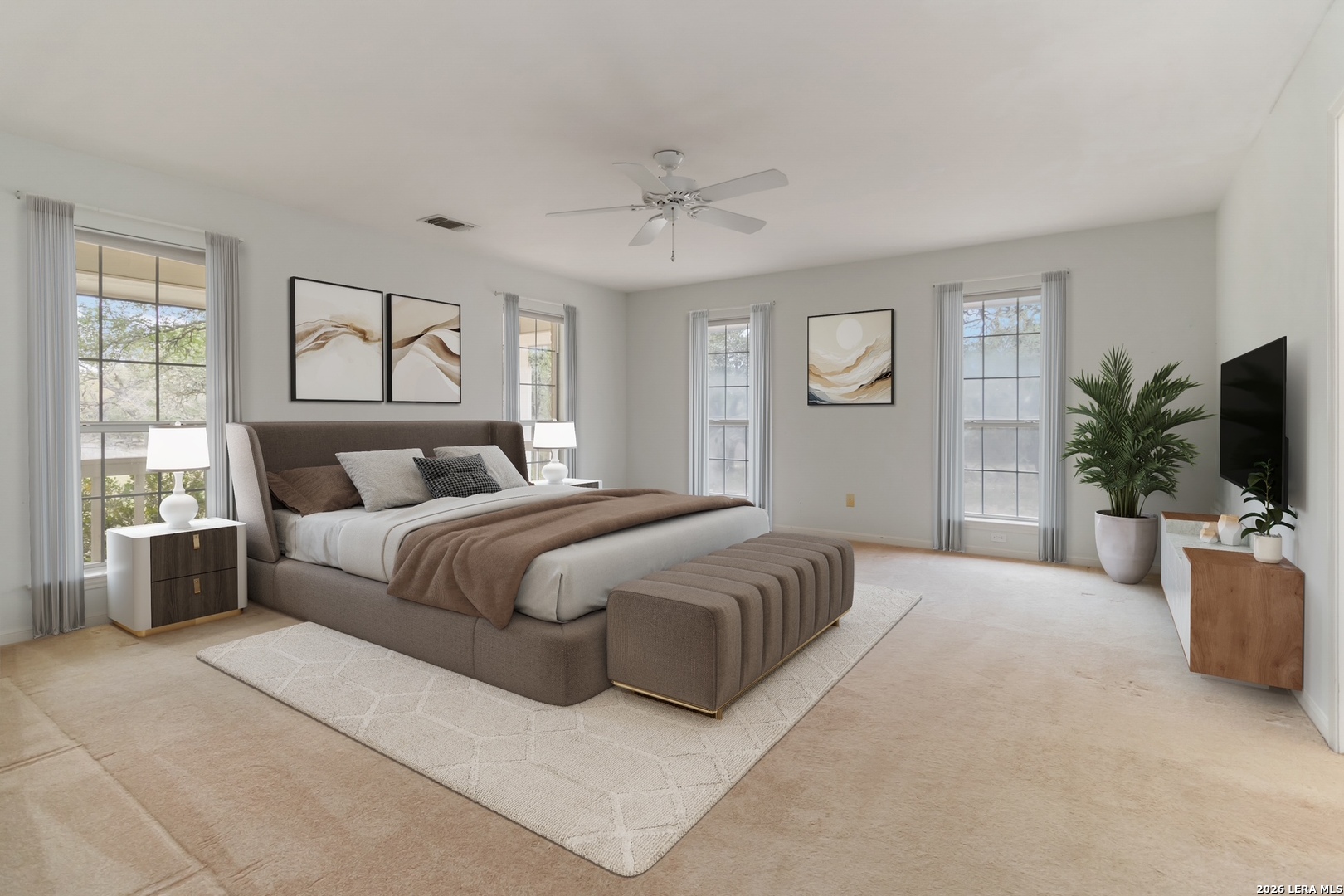 31949 Oak Ridge Parkway Bulverde, TX 78163 - Photo 24 of 50 a spacious bedroom with a large bed and a flat screen television