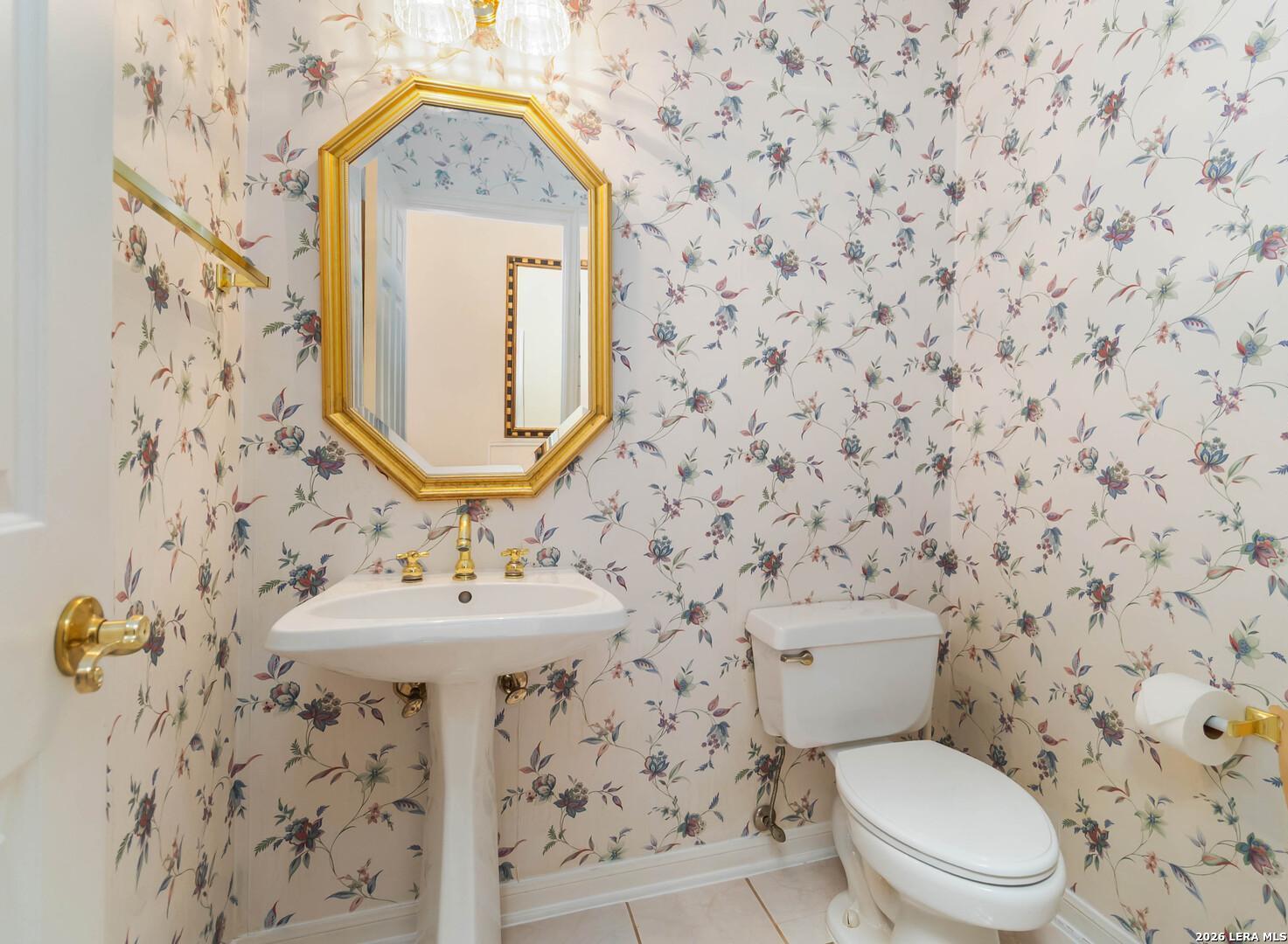 31949 Oak Ridge Parkway Bulverde, TX 78163 - Photo 27 of 50 a bathroom with a sink and a toilet