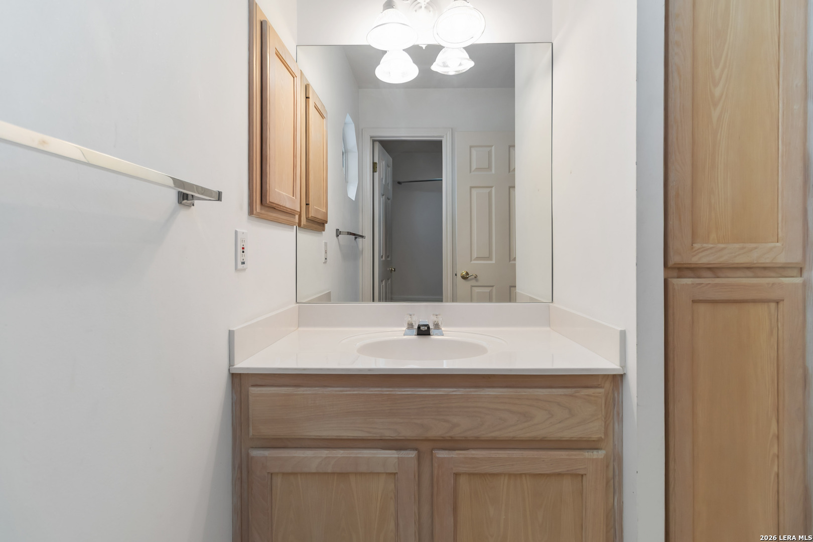 31949 Oak Ridge Parkway Bulverde, TX 78163 - Photo 30 of 50 a bathroom with a sink and a mirror