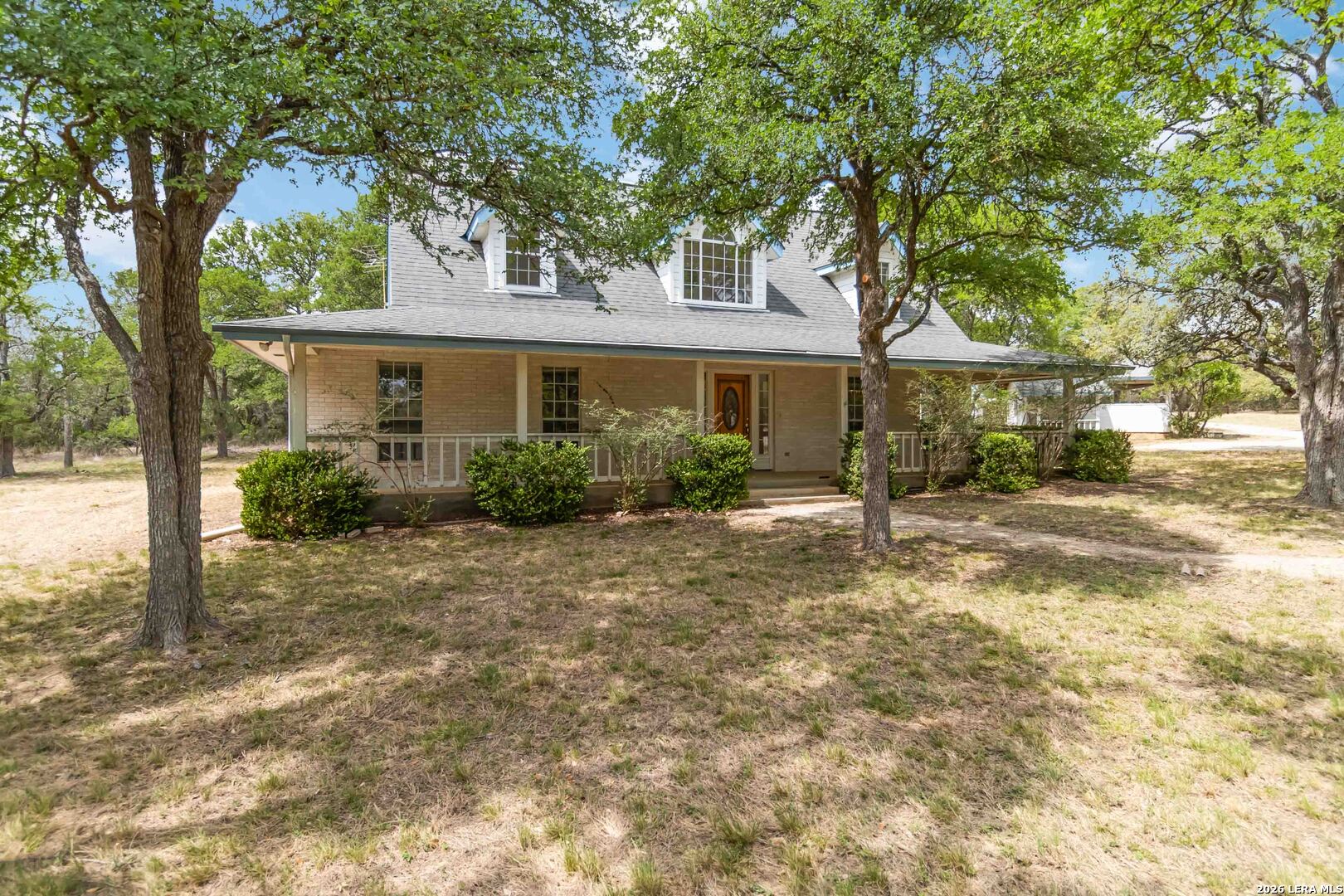 31949 Oak Ridge Parkway Bulverde, TX 78163 - Photo 3 of 50 a view of a house with backyard and a tree
