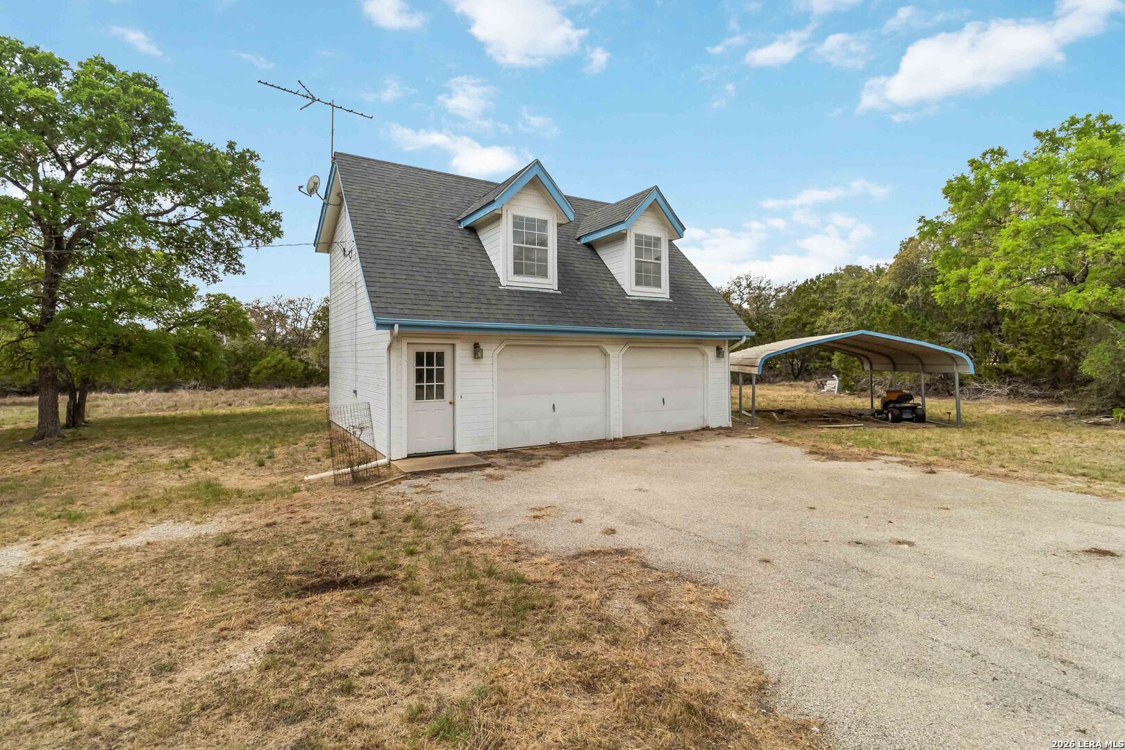 31949 Oak Ridge Parkway Bulverde, TX 78163 - Photo 36 of 50 a front view of a house with a yard and garage