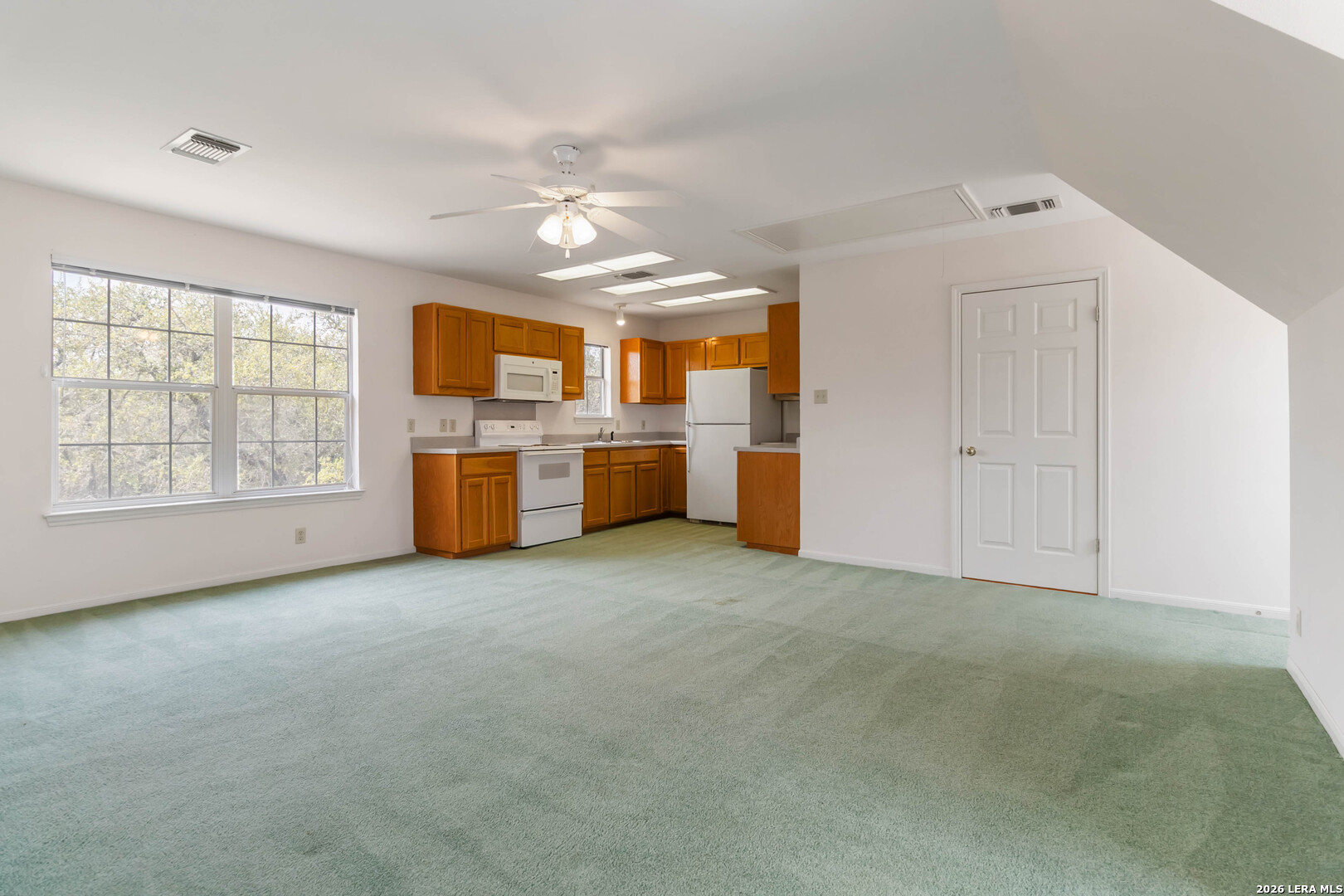 31949 Oak Ridge Parkway Bulverde, TX 78163 - Photo 37 of 50 an empty room with chandelier fan and windows