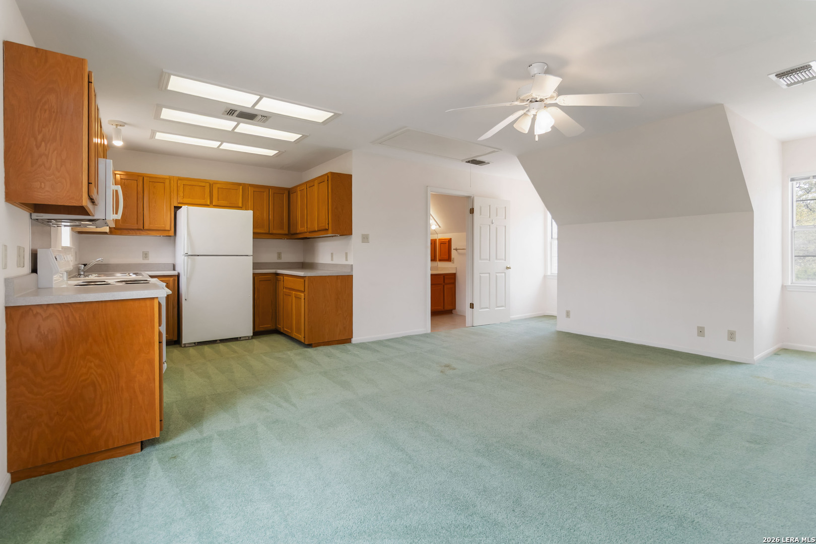 31949 Oak Ridge Parkway Bulverde, TX 78163 - Photo 39 of 50 a view of a kitchen with a sink and a refrigerator