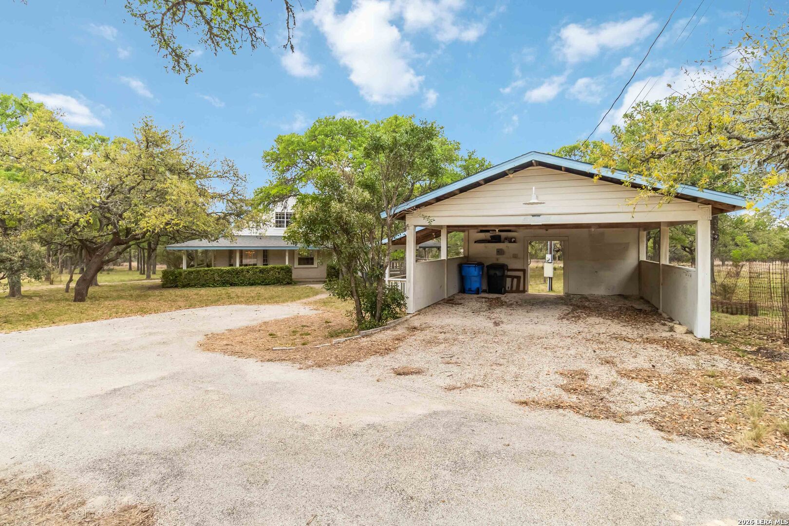 31949 Oak Ridge Parkway Bulverde, TX 78163 - Photo 42 of 50 a front view of a house with a yard and garage