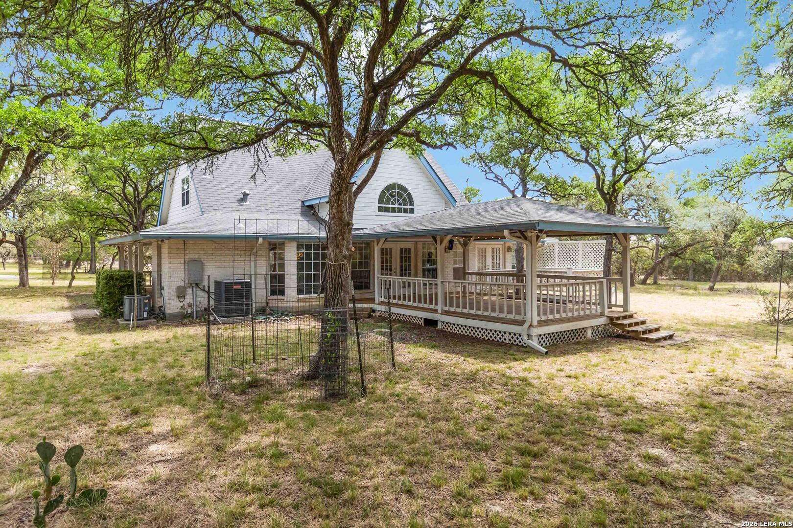 31949 Oak Ridge Parkway Bulverde, TX 78163 - Photo 43 of 50 a view of a house with a yard balcony and a tree