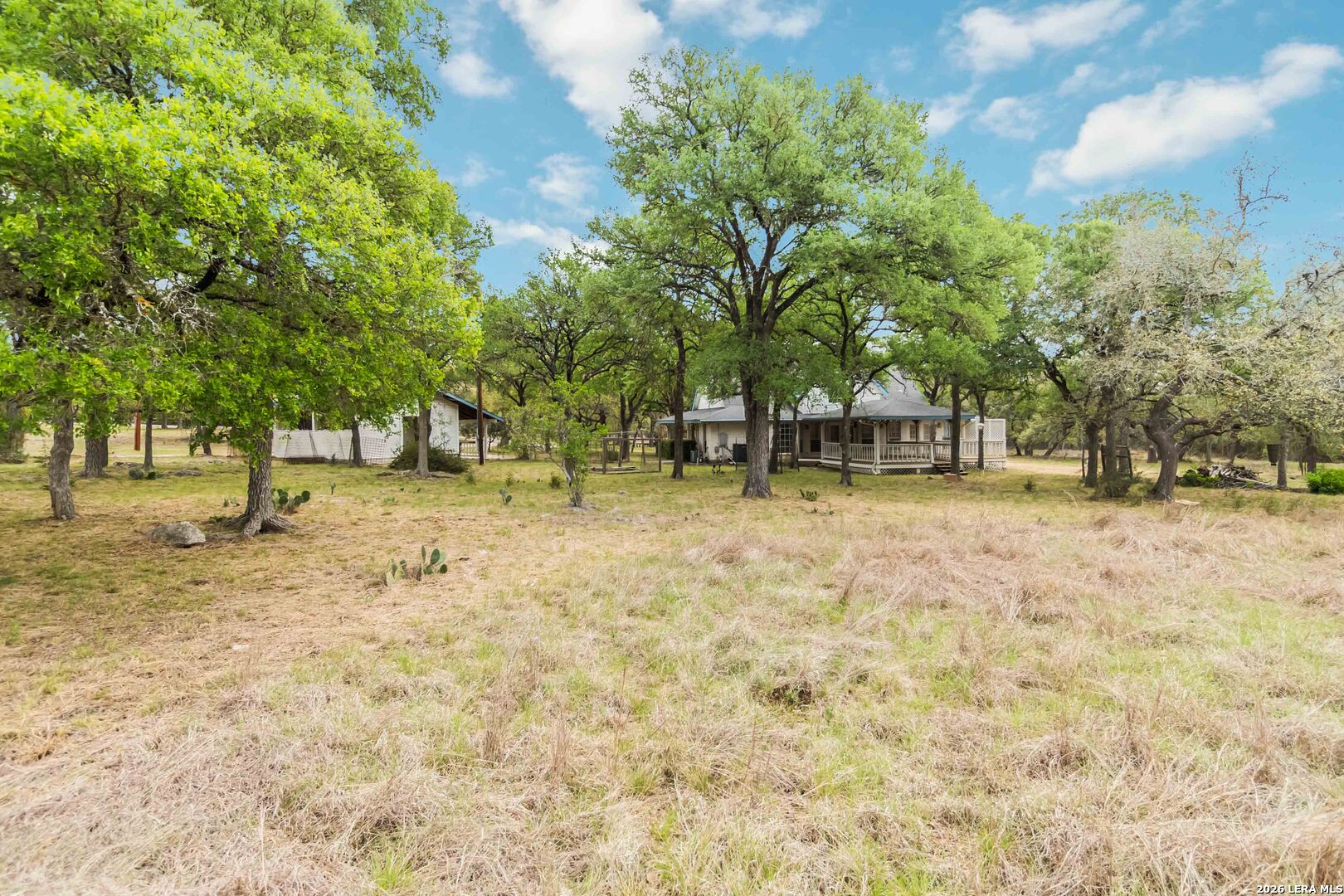 31949 Oak Ridge Parkway Bulverde, TX 78163 - Photo 47 of 50 a backyard of a house with a trees