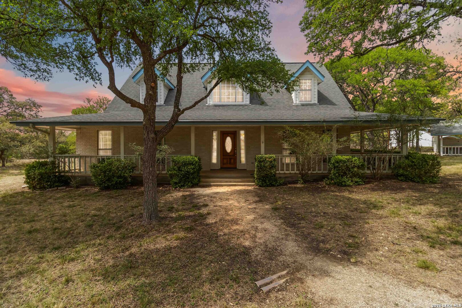 31949 Oak Ridge Parkway Bulverde, TX 78163 - Photo 50 of 50 a front view of a house with a garden