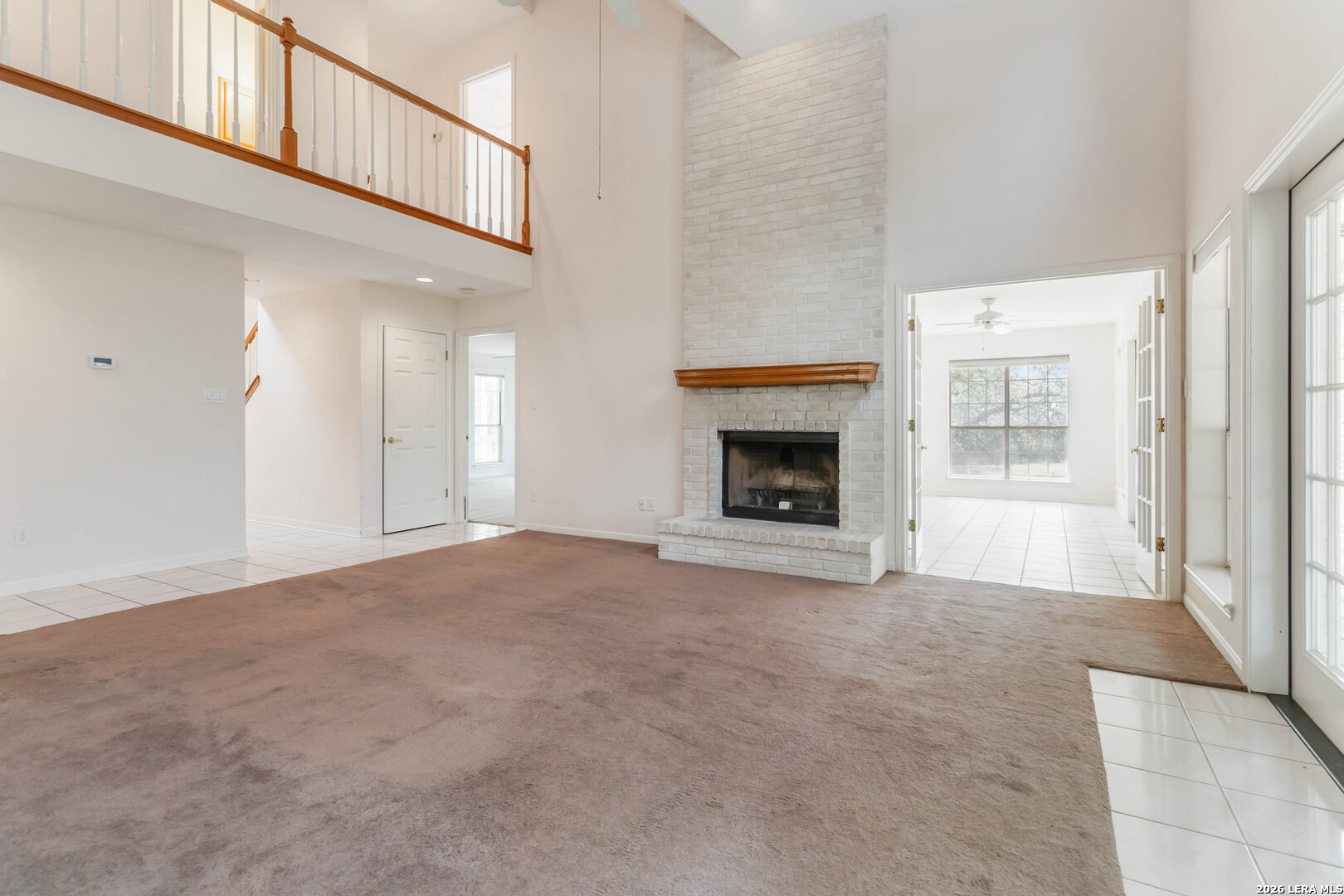 31949 Oak Ridge Parkway Bulverde, TX 78163 - Photo 9 of 50 a view of an empty room with window and a fireplace
