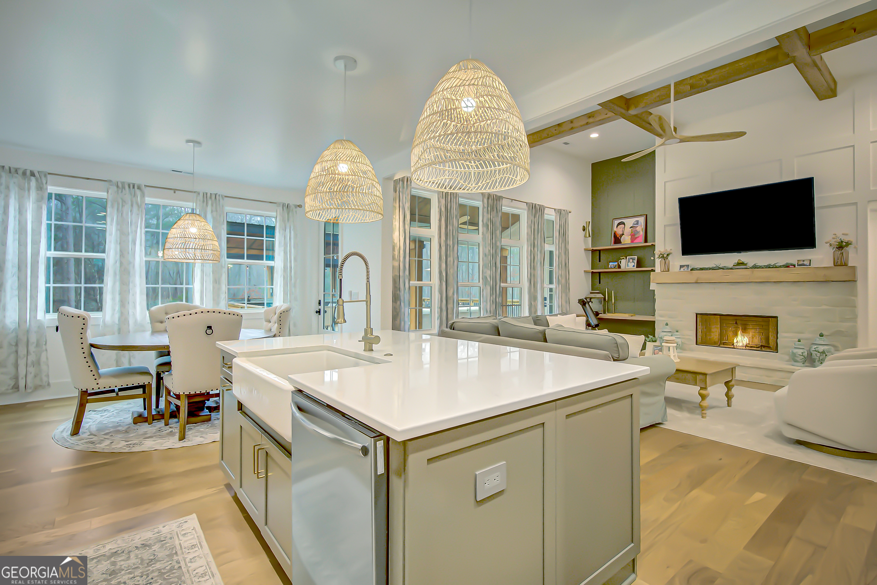 140 South Alexander Creek Road Newnan, GA 30263 - Photo 11 of 67 a living room with furniture a flat screen tv and a fireplace