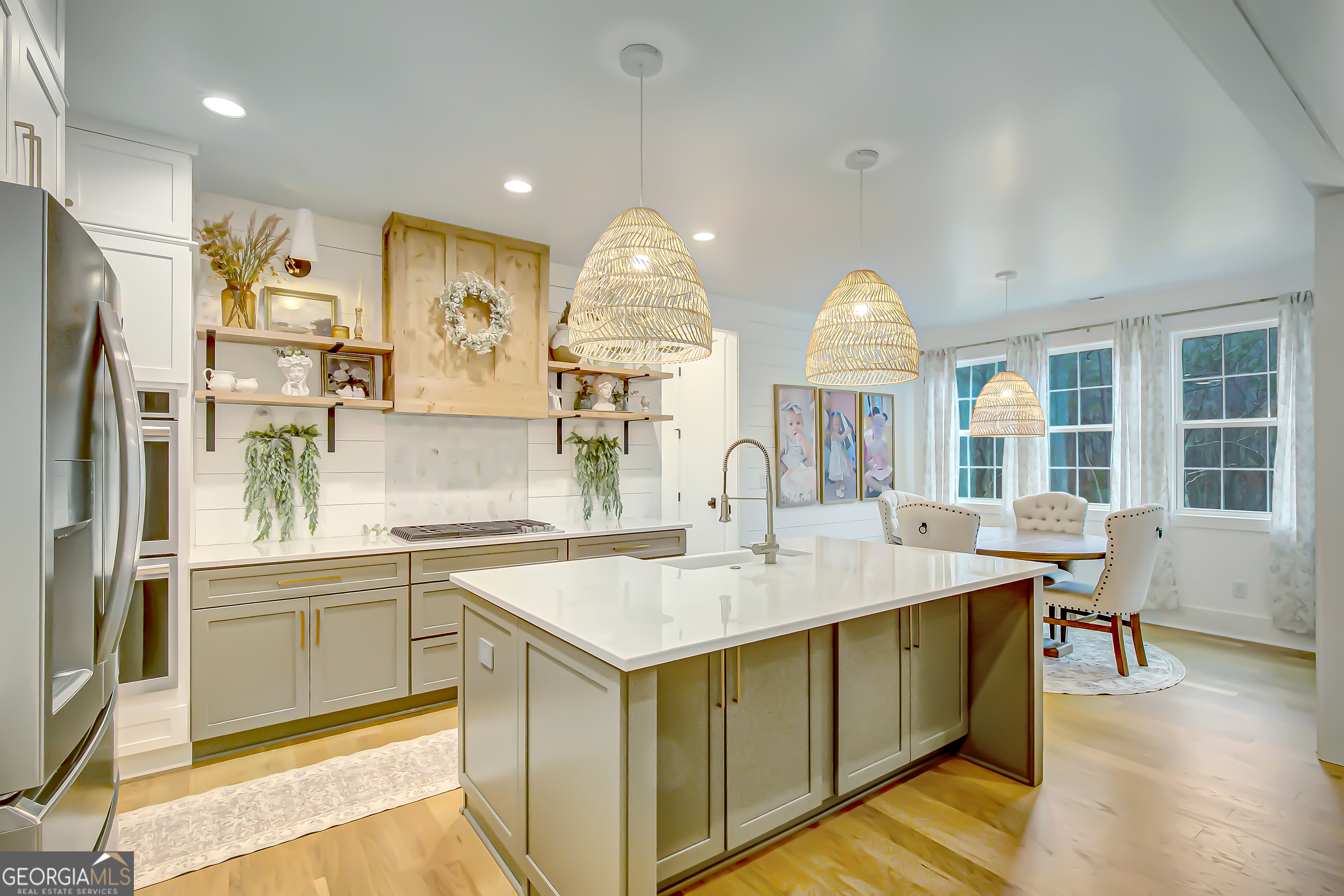 140 South Alexander Creek Road Newnan, GA 30263 - Photo 12 of 67 a kitchen with stainless steel appliances granite countertop a sink a stove and a refrigerator