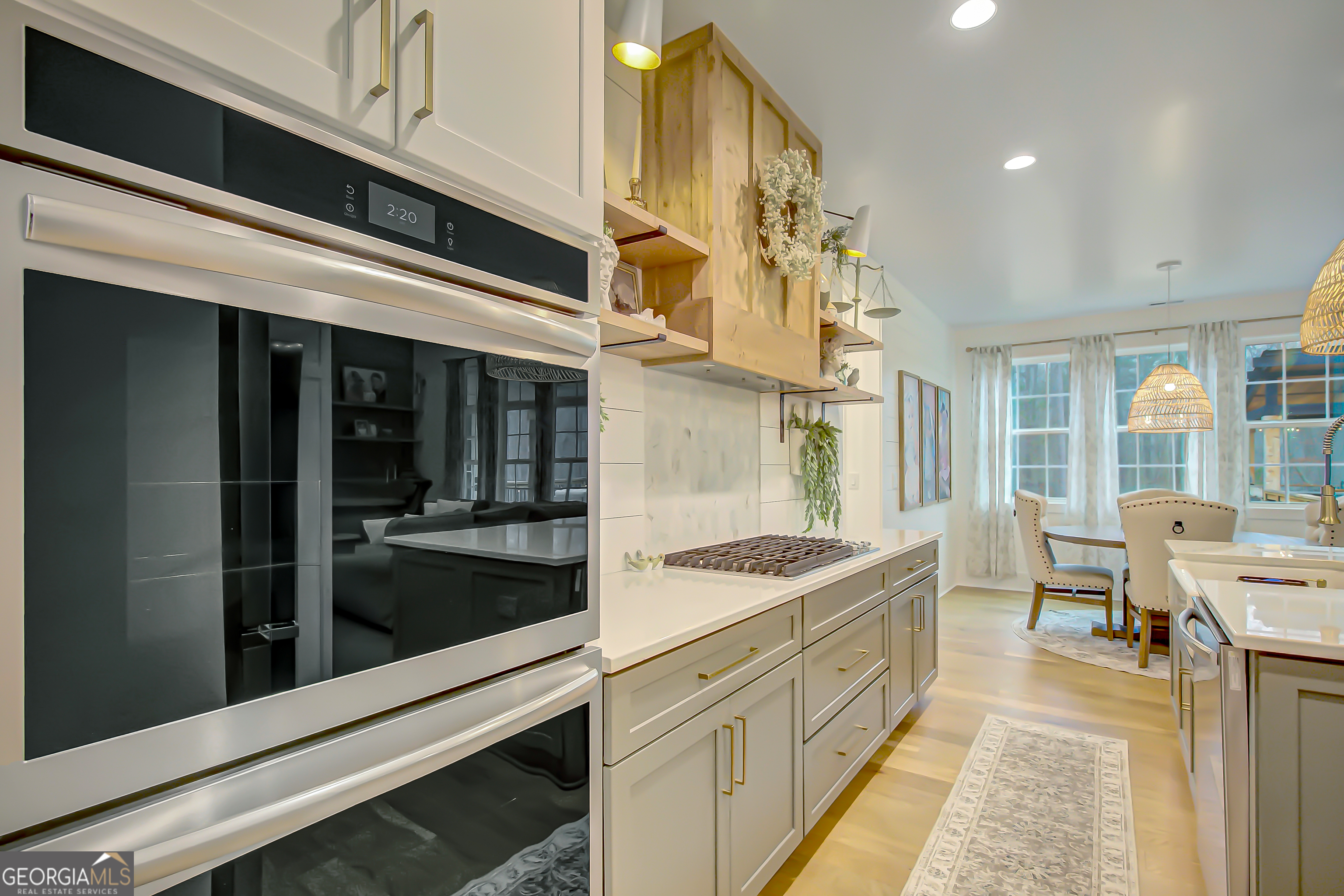 140 South Alexander Creek Road Newnan, GA 30263 - Photo 18 of 67 a kitchen with stainless steel appliances kitchen island granite countertop a refrigerator and a stove