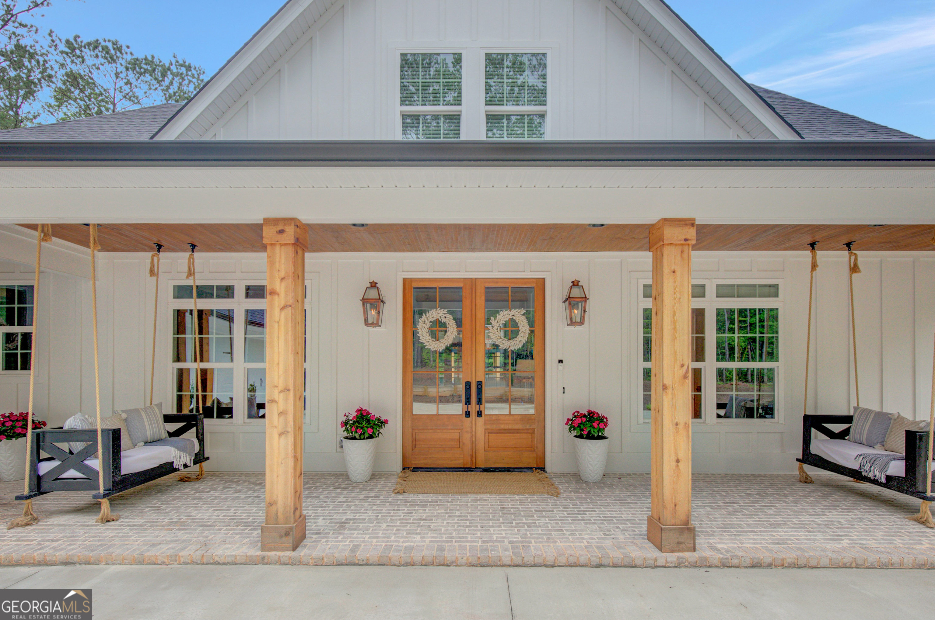 140 South Alexander Creek Road Newnan, GA 30263 - Photo 2 of 67 a view of a building with glass door and couch