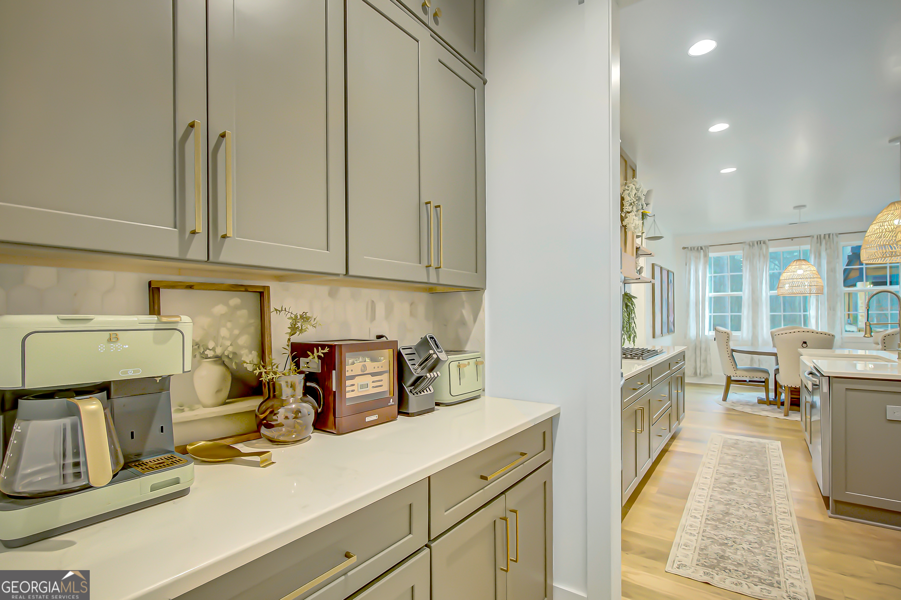 140 South Alexander Creek Road Newnan, GA 30263 - Photo 21 of 67 a kitchen with a sink and cabinets