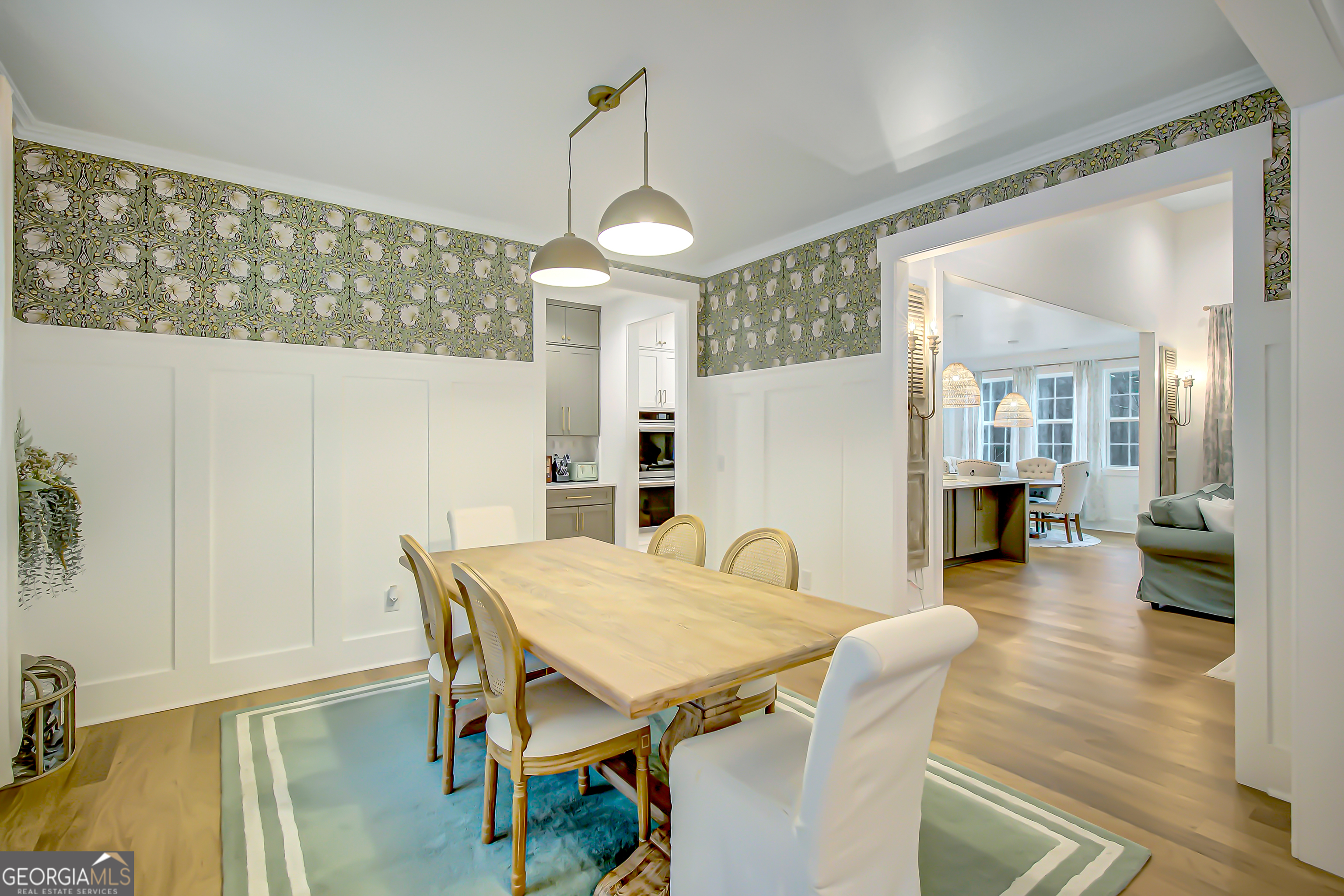 140 South Alexander Creek Road Newnan, GA 30263 - Photo 23 of 67 a view of a dining room and livingroom with furniture wooden floor a chandelier
