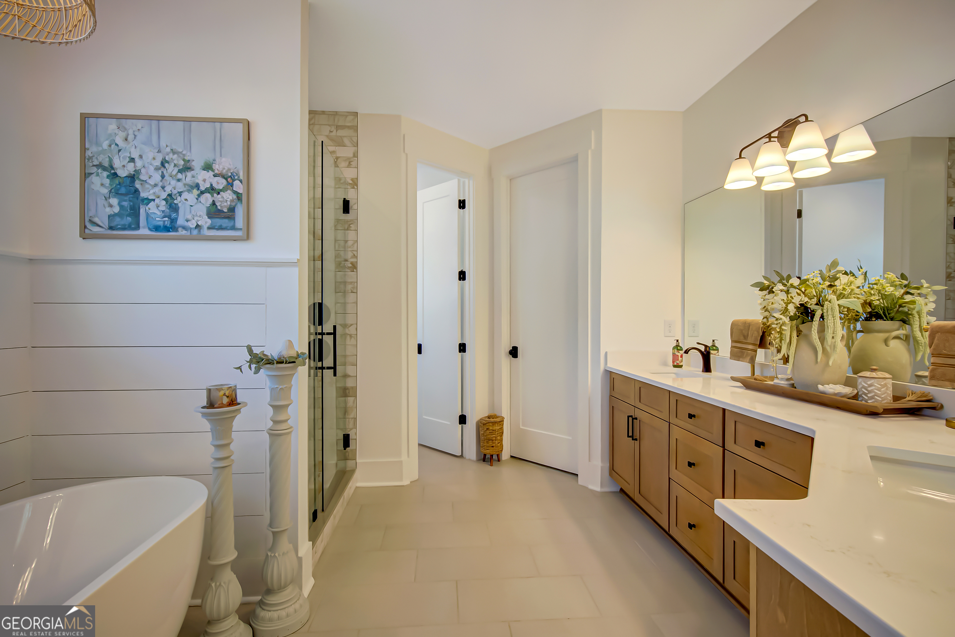 140 South Alexander Creek Road Newnan, GA 30263 - Photo 28 of 67 a bathroom with a double vanity sink a toilet a mirror and shower