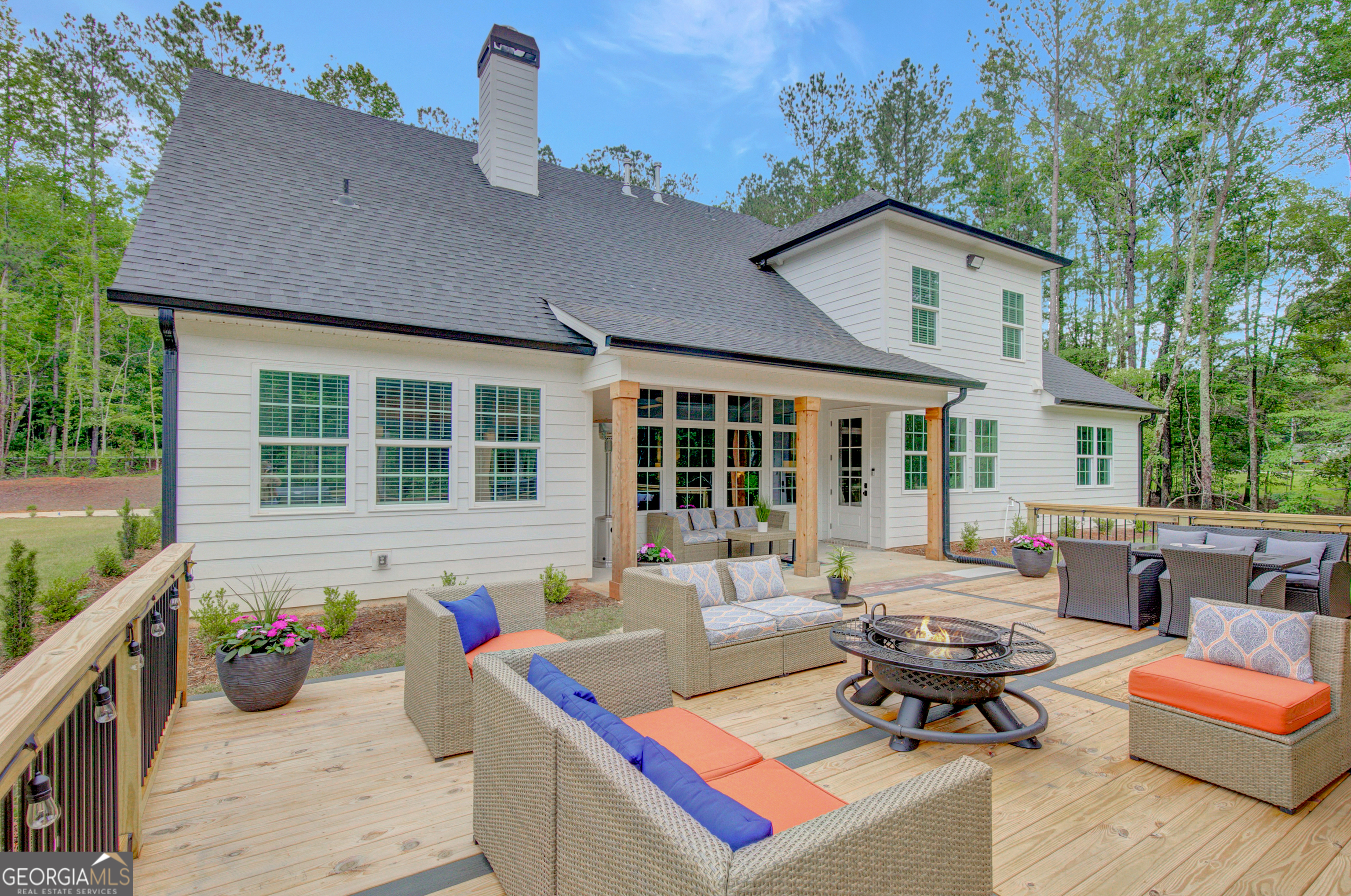 140 South Alexander Creek Road Newnan, GA 30263 - Photo 3 of 67 a view of a house with a backyard and sitting area