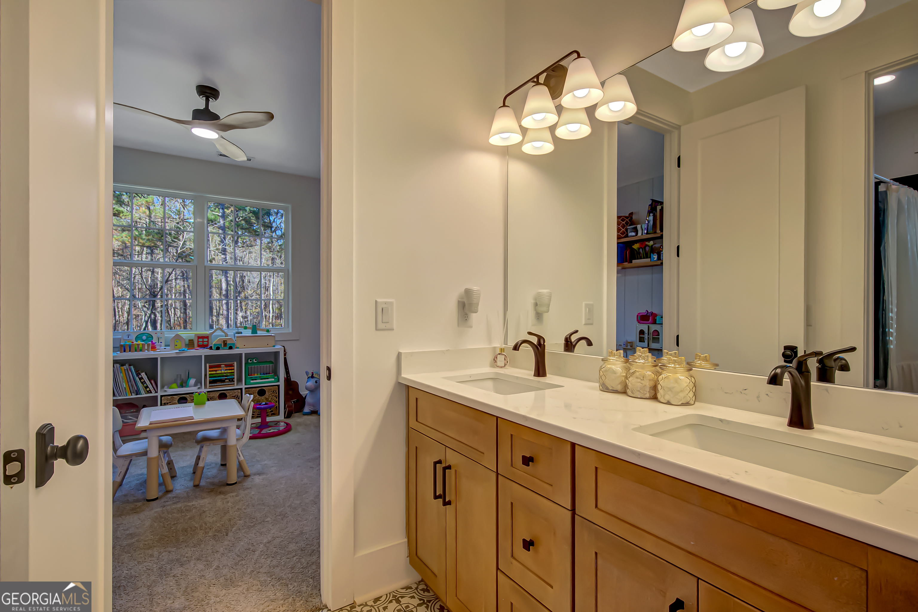 140 South Alexander Creek Road Newnan, GA 30263 - Photo 35 of 67 a bathroom with a double vanity sink and a mirror
