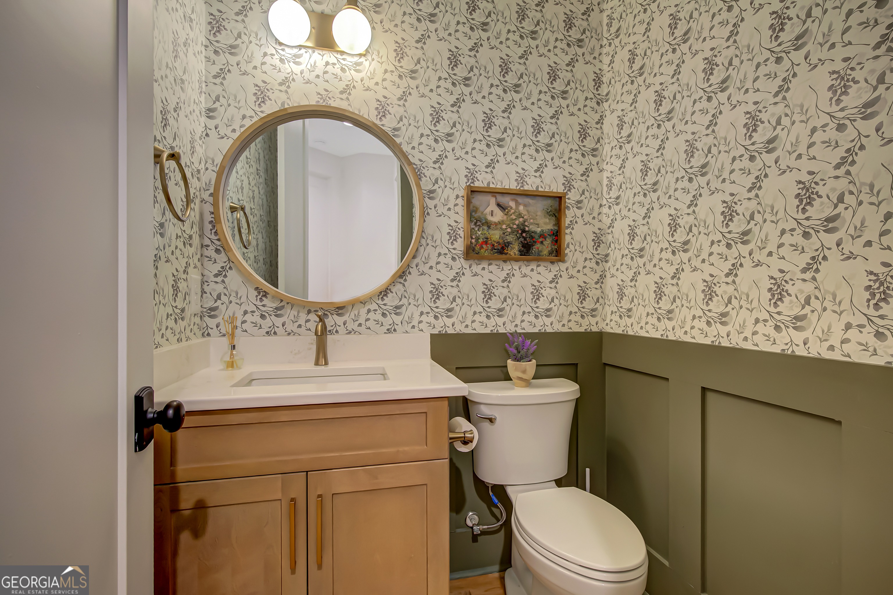 140 South Alexander Creek Road Newnan, GA 30263 - Photo 38 of 67 a bathroom with a toilet sink and mirror