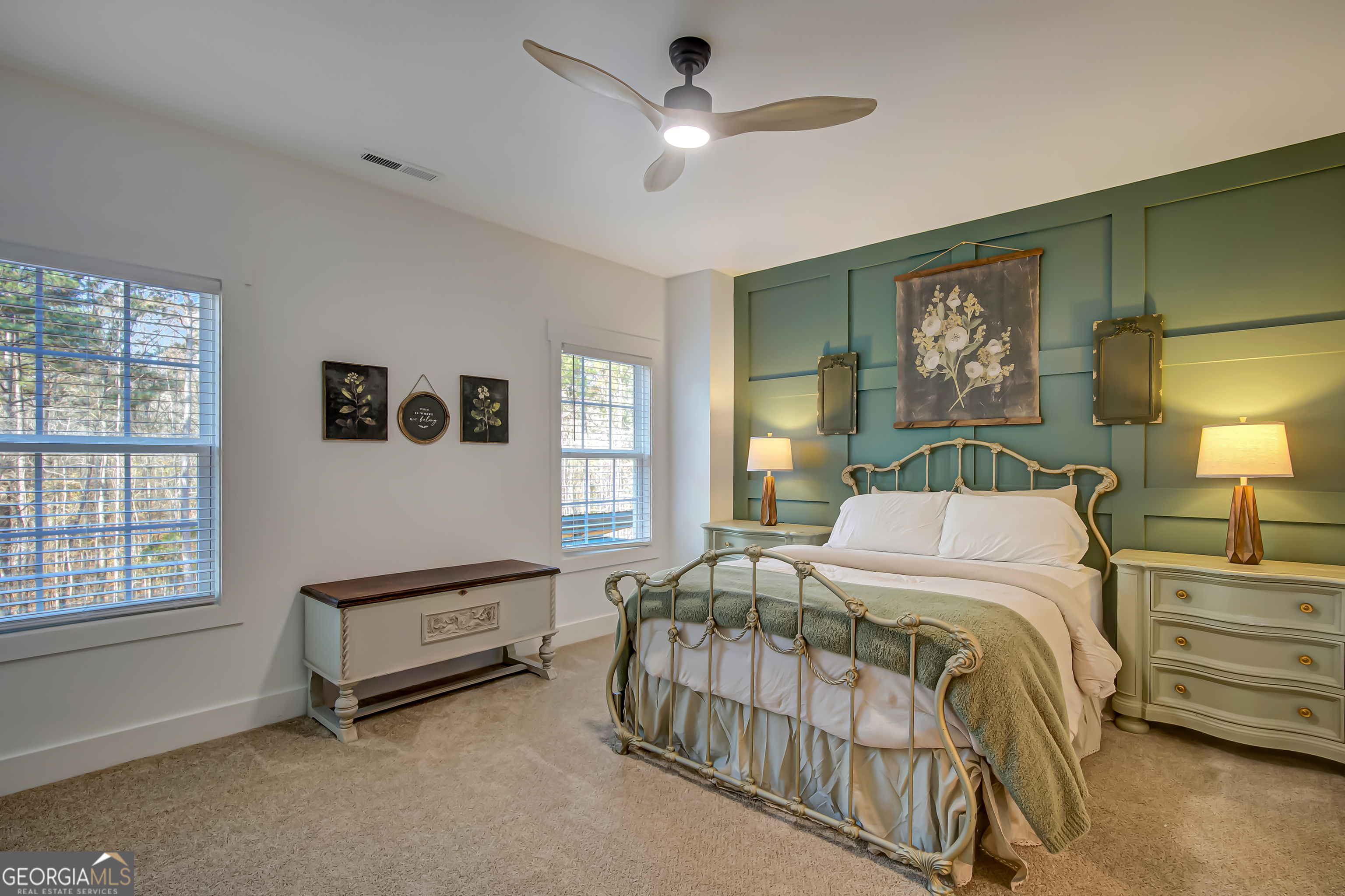 140 South Alexander Creek Road Newnan, GA 30263 - Photo 47 of 67 a bedroom with a bed a dresser and paintings on the wall