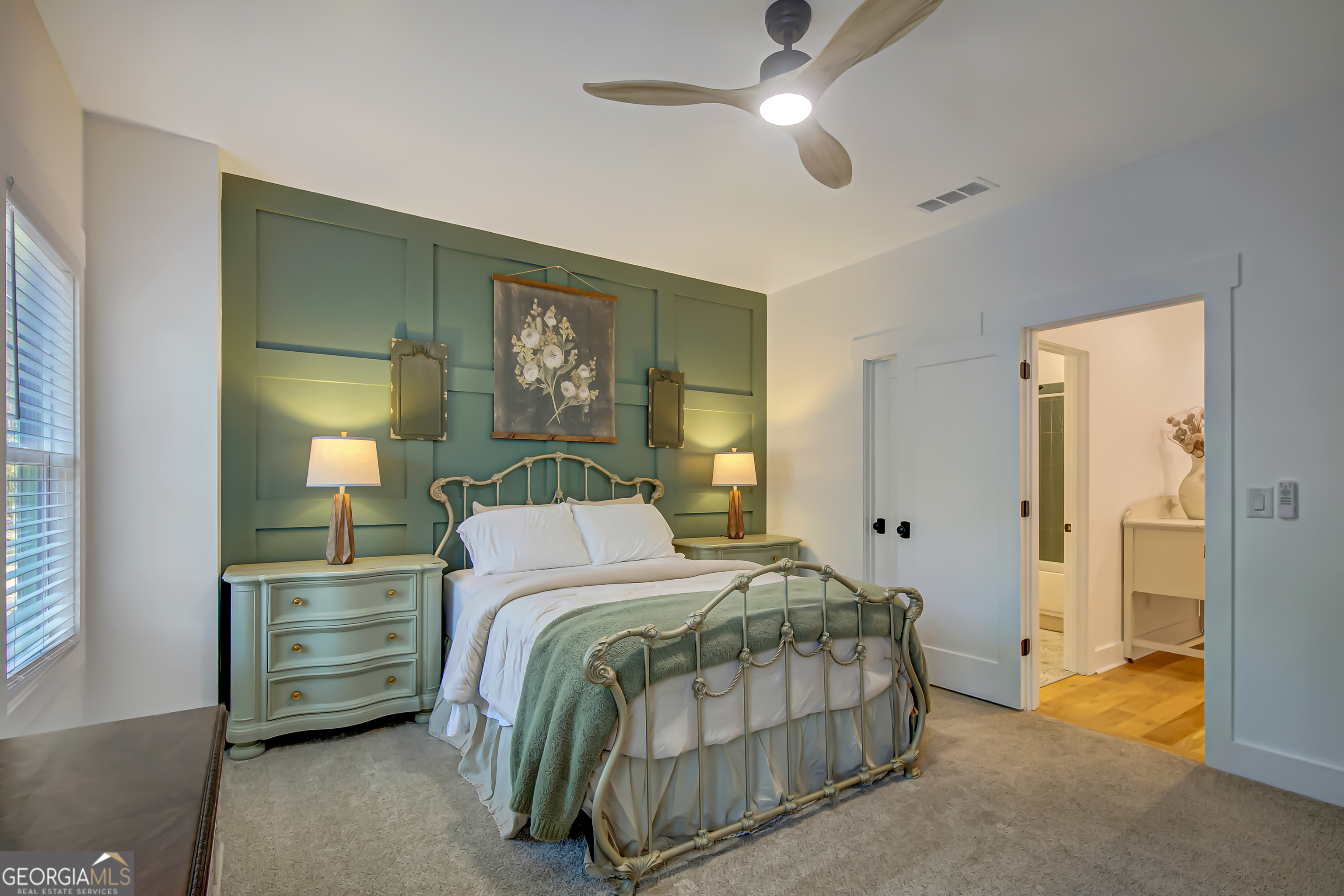 140 South Alexander Creek Road Newnan, GA 30263 - Photo 48 of 67 a bedroom with a bed and a chandelier