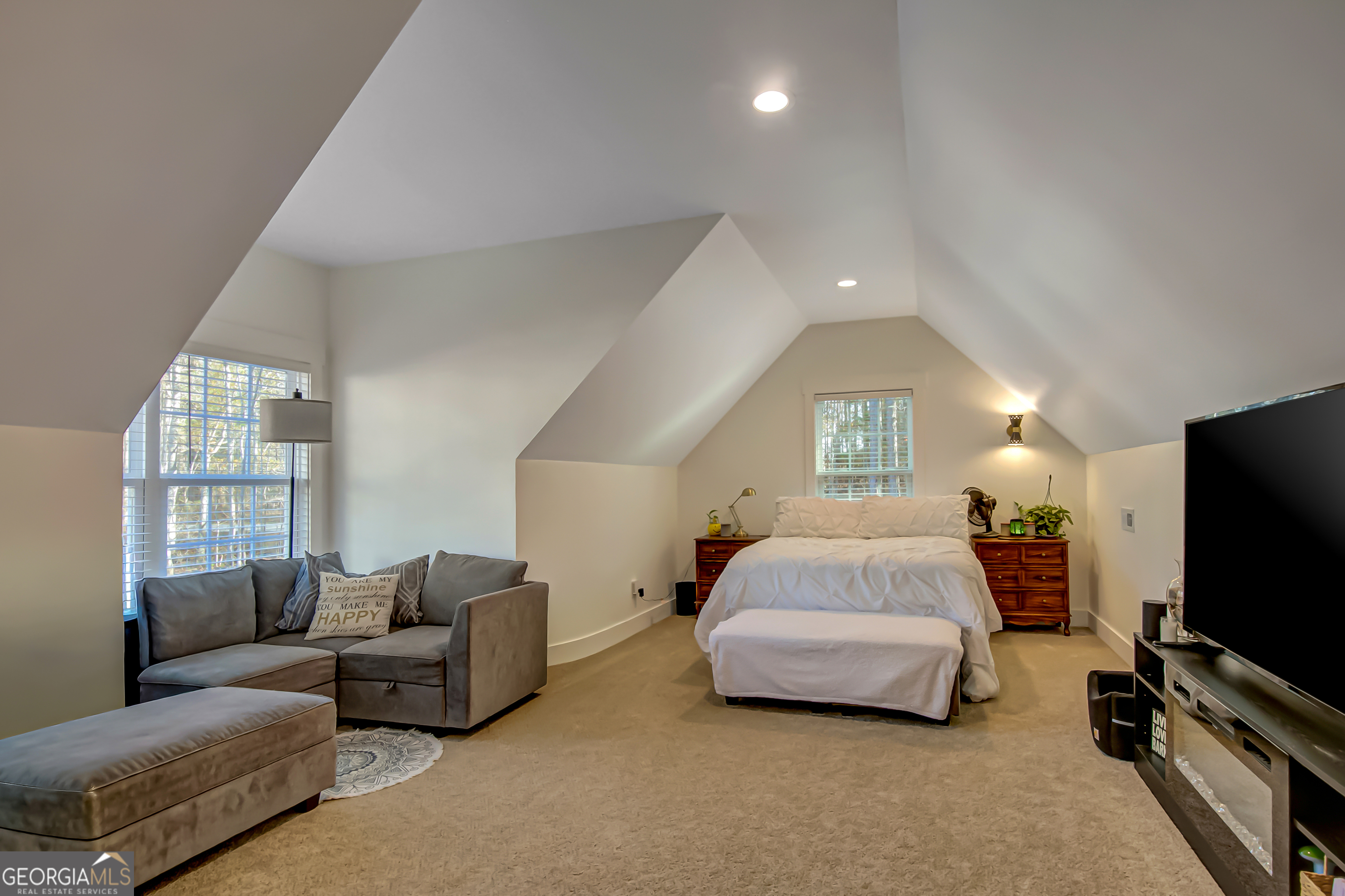 140 South Alexander Creek Road Newnan, GA 30263 - Photo 51 of 67 a living room with a couch and a flat screen tv