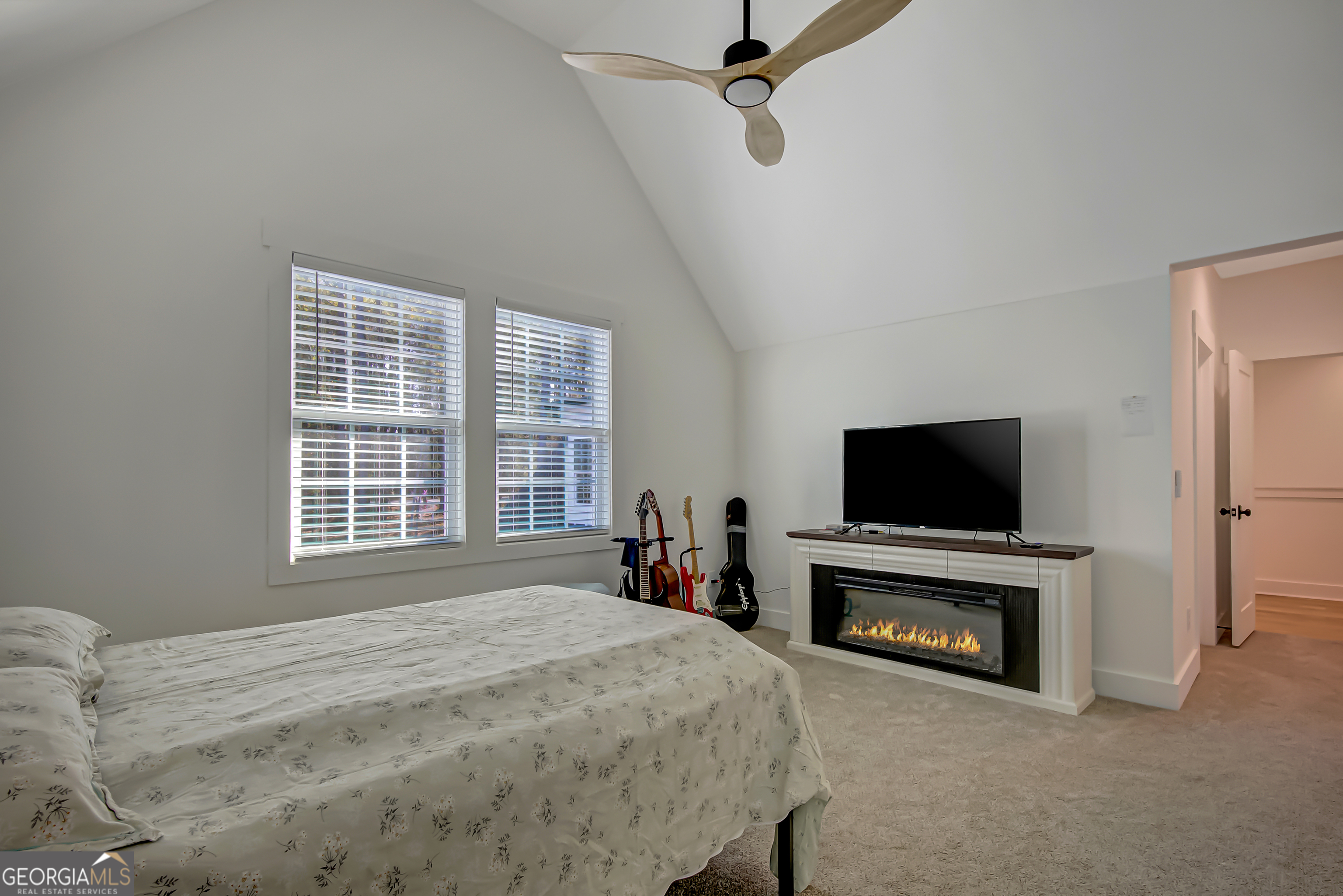 140 South Alexander Creek Road Newnan, GA 30263 - Photo 53 of 67 a bedroom with a bed and a television