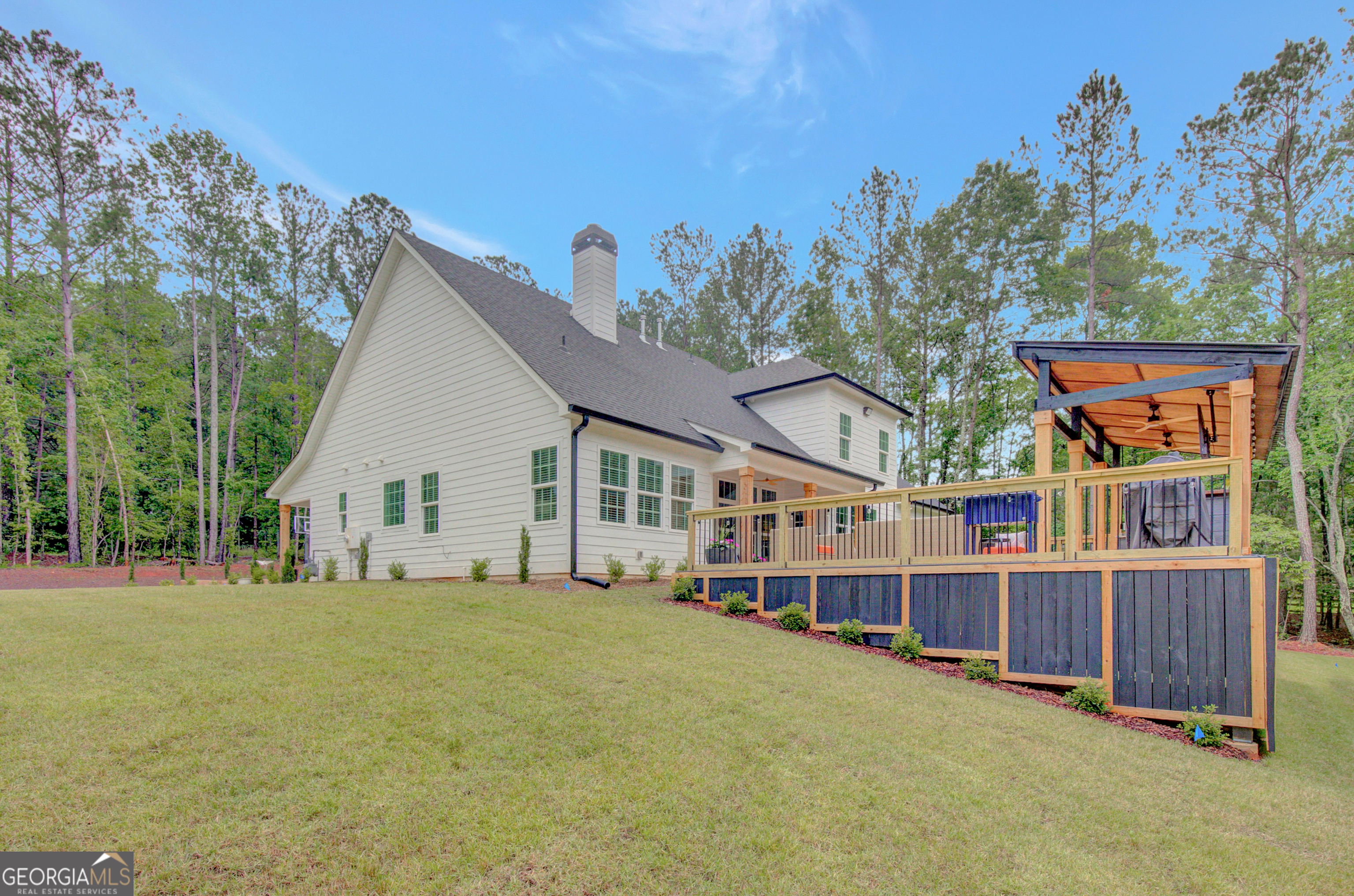 140 South Alexander Creek Road Newnan, GA 30263 - Photo 63 of 67 a view of a house with a yard and trees