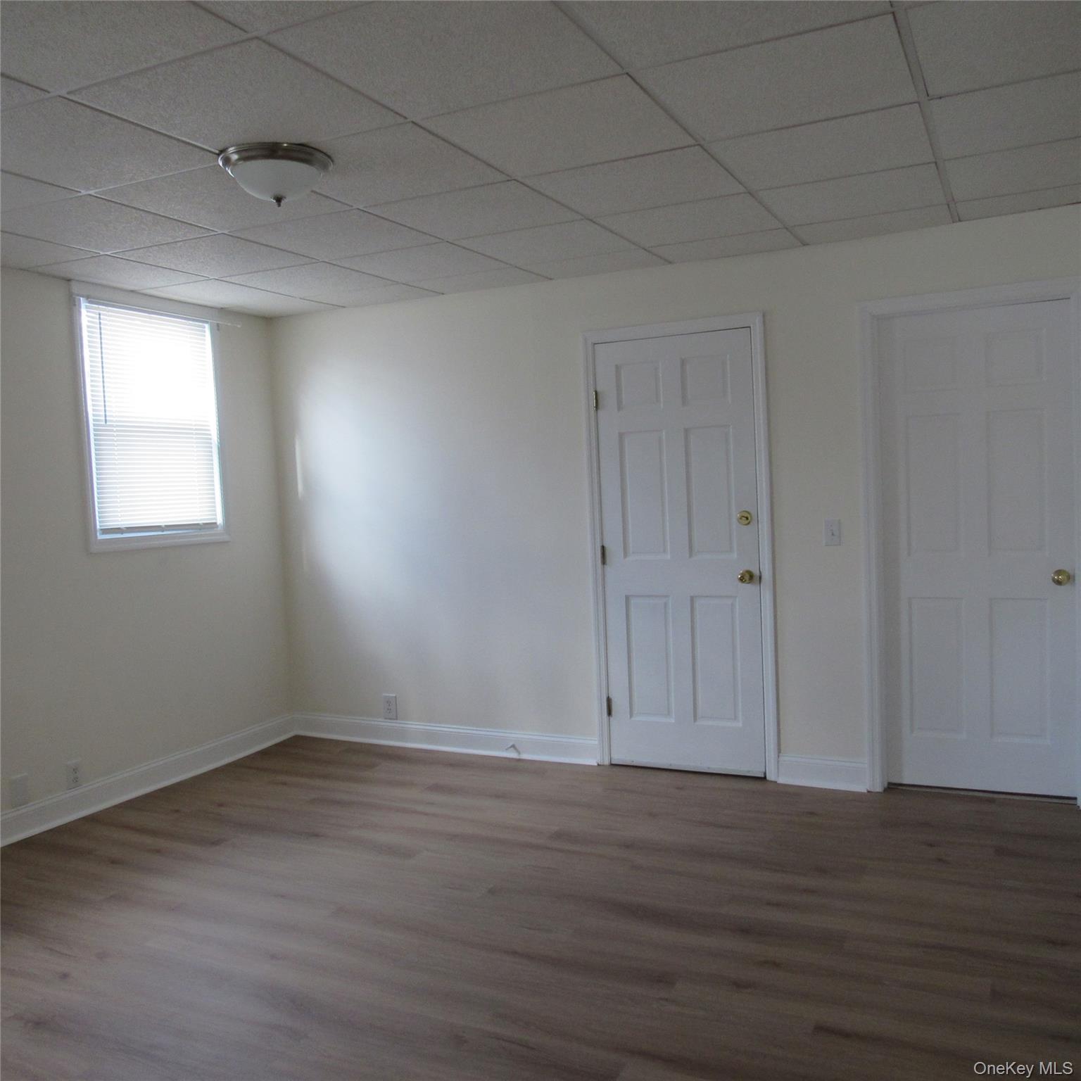35 Taylor Avenue, Unit 2 Poughkeepsie, NY 12601 - Photo 12 of 19 Livingroom featuring a paneled ceiling and wood finished floors