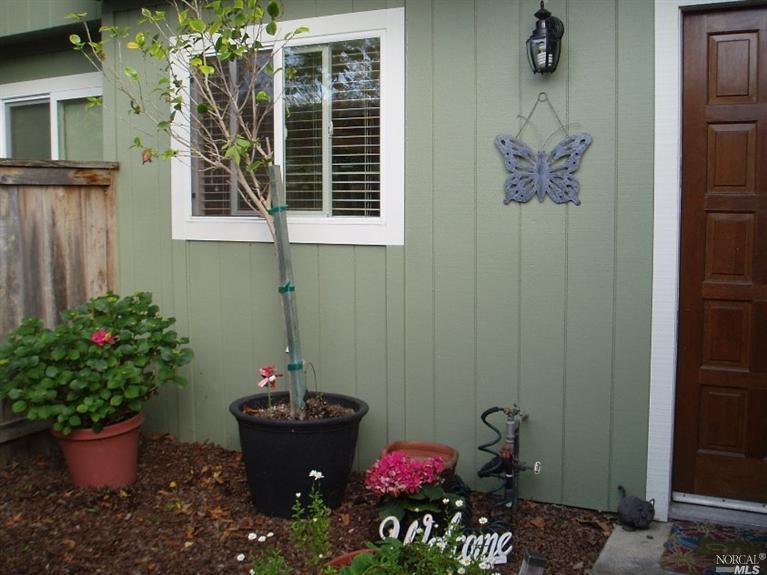 677 Racquet Club Circle Rohnert Park, CA 94928 - Photo 1 of 1 a front view of a house with a potted plant