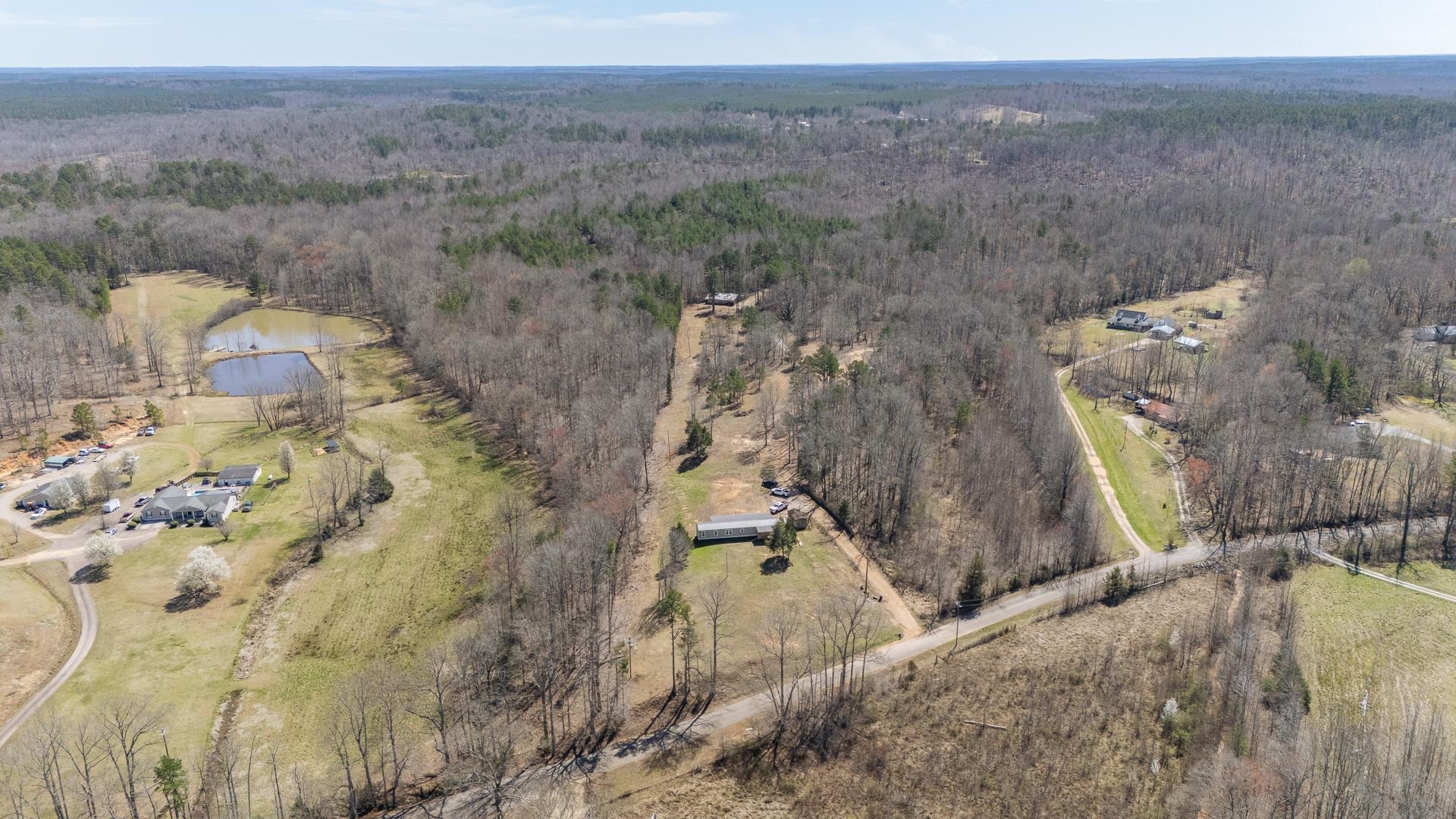 1670 Rose Creek Road Selmer, TN 38375 - Photo 11 of 40 a view of a yard in a field