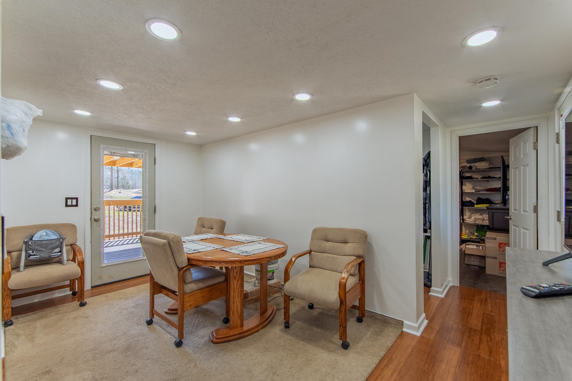 1670 Rose Creek Road Selmer, TN 38375 - Photo 16 of 40 a view of a a dining room with furniture window and wooden floor