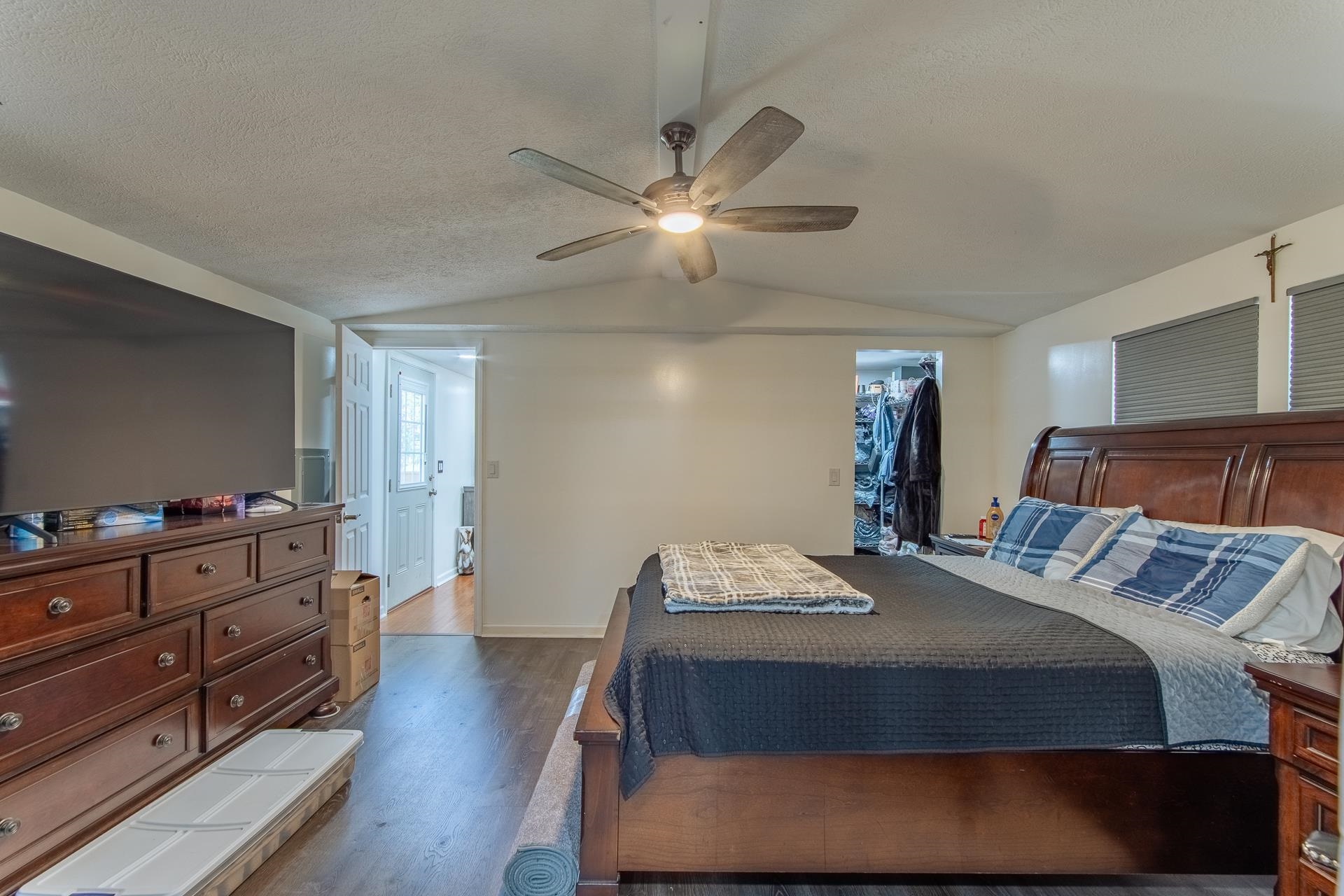 1670 Rose Creek Road Selmer, TN 38375 - Photo 22 of 40 a bedroom with a bed and a chandelier