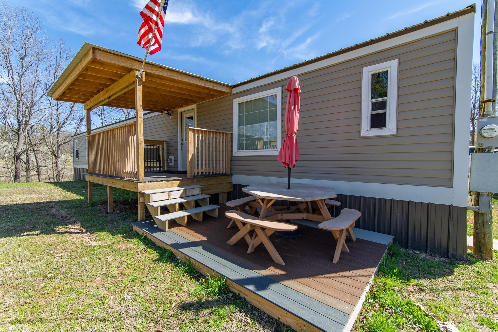 1670 Rose Creek Road Selmer, TN 38375 - Photo 3 of 40 a view of a backyard with sitting area