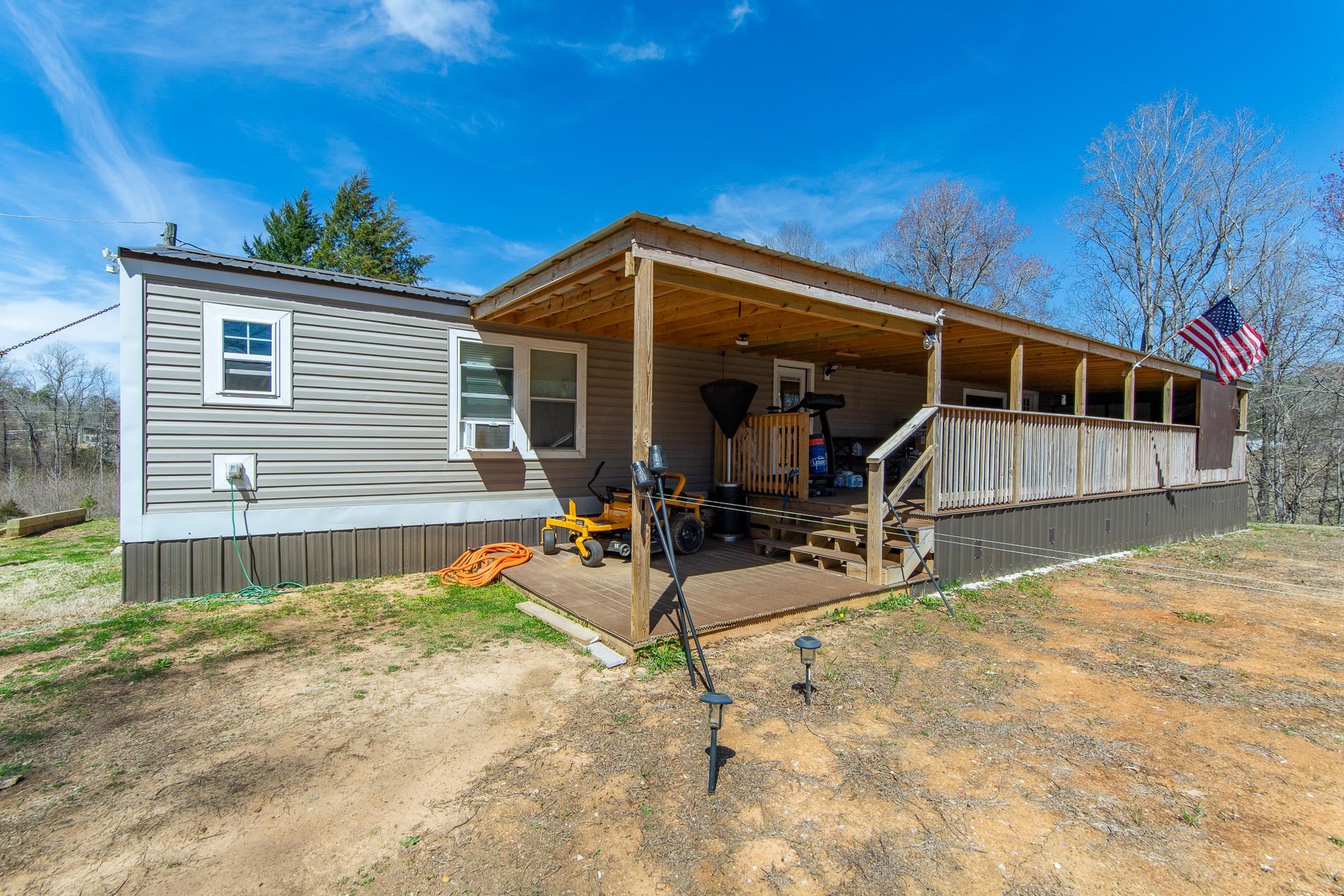 1670 Rose Creek Road Selmer, TN 38375 - Photo 4 of 40 a view of a house with backyard and sitting area