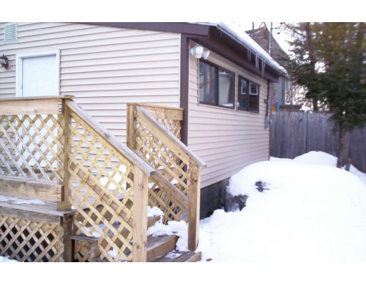 3 Valley Road Holbrook, MA 02343 - Photo 4 of 12 a view of a house with a wooden fence