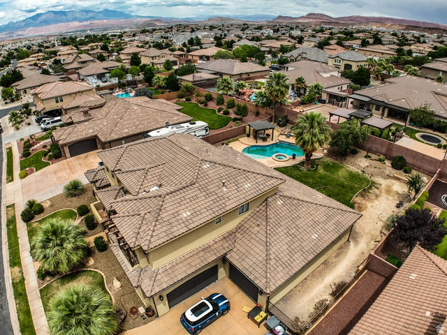 3683 South 2640 West St. George, UT 84790 - Photo 6 of 41 Residential property featuring a tile roof, multi-car garage, and desert-adapted landscaping