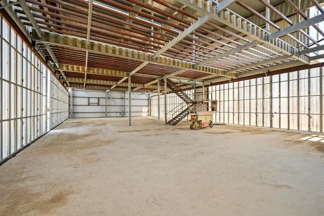 a view of an empty room with a garage