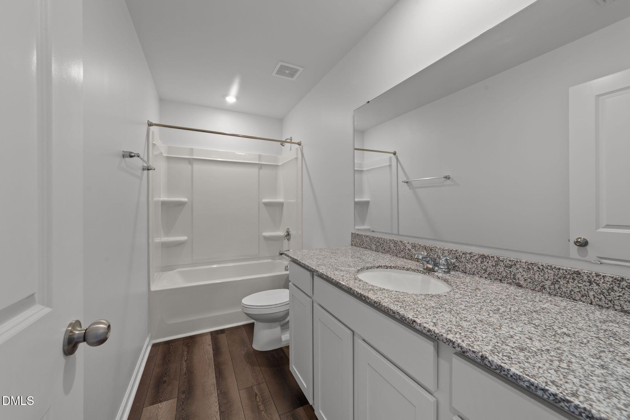 1421 Justice Union Court Raleigh, NC 27604 - Photo 19 of 21 a bathroom with a granite countertop sink a toilet and shower