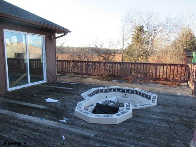 975 12th Street Hammonton, NJ 08037 - Photo 29 of 31 a view of a deck with a chair and floor to ceiling window