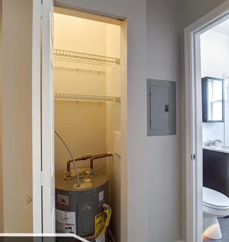 a bathroom with a toilet a sink and a window