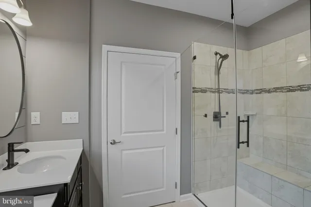 a bathroom with a double vanity sink mirror and toilet