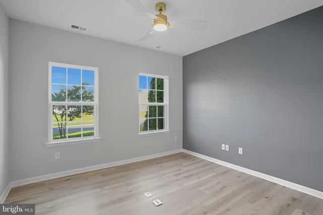 a bathroom with a glass shower door and a sink