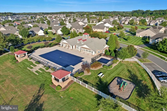 an aerial view of residential house with outdoor space and street view