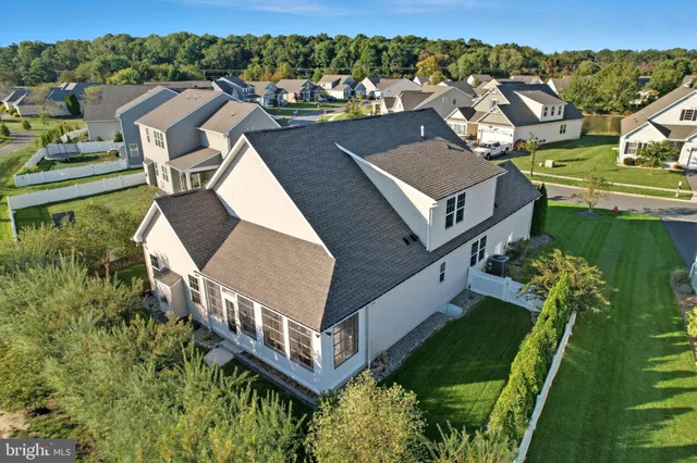 an aerial view of a house with a garden