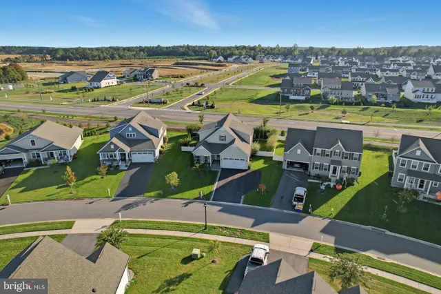 an aerial view of a house with a ocean view